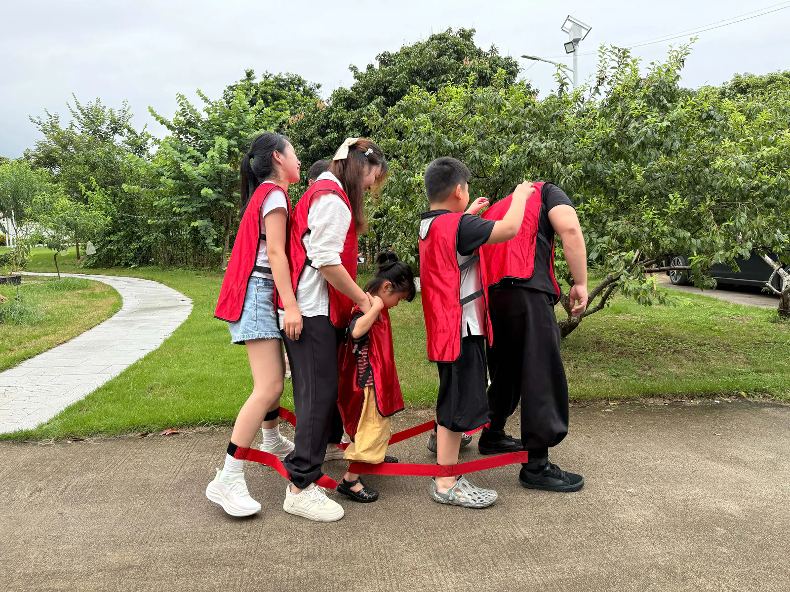 The red team coordinating their steps during an outdoor group challenge